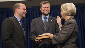 Carrie being sworn in as Peace Corps Director. Husband Steve shares the moment