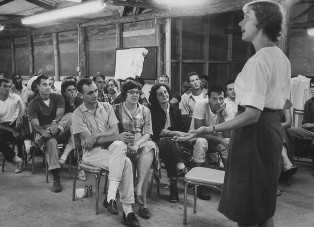 Margery speaking to Trainees in Puerto Rico, photo was taken by renowened photojournalist, Carl Mydans